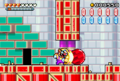 Wario ramming a round red rock
