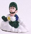 A figurine with Luigi sitting on a cloud and holding a Starman. Pull it back and it rolls