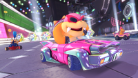 A screenshot of the Koopalings driving through Electrodrome in Mario Kart 8