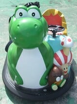 A coin-operated bumper kart from Banpresto featuring Yoshi.
