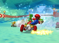 Mario and Yoshi drive through Sherbet Land's ice tunnel.