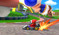 Shy Guy driving past the Blue Toad balloon in 3DS Toad Circuit in Mario Kart 7