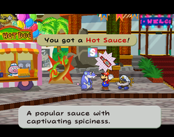 Mario getting a Hot Sauce from the businessman in Glitzville of Paper Mario: The Thousand-Year Door.