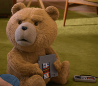 Ted (2024) Season 1 Episode 1 "Just Say Yes" featuring a Super Mario Bros. / Duck Hunt NES cartridge.