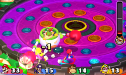 Mario, Waluigi, Donkey Kong, and Wario fighting the Bowser Jr.'s Pound for Pound boss fight in Mario Party: Star Rush.