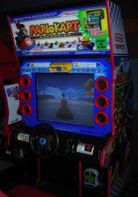 An arcade cabinet for the game Mario Kart Arcade GP