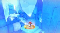 Mario preparing to use the 1,000-Fold Arms to break off a large icicle inside the Ice Vellumental Mountain.
