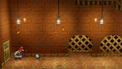 Mario after blowing away the poster containing an Ice Storm in Riverside Station of Paper Mario: The Thousand-Year Door for Nintendo Switch.