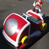 A coin-operated bumper kart from Banpresto featuring Mario.