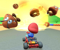 Thumbnail of the Baby Mario Cup challenge from the New York Tour; a Goomba Takedown challenge set on SNES Mario Circuit 1