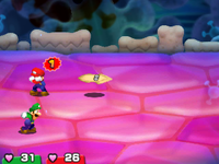 Screenshot of Mario guarding against a Dried Blooper from Mario & Luigi: Bowser's Inside Story + Bowser Jr.'s Journey