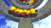 Mario in Supermassive Galaxy in Super Mario Galaxy 2. Giant Wigglers are seen.