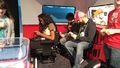 The Nintendo Switch being demonstrated in Handheld mode in a van setting