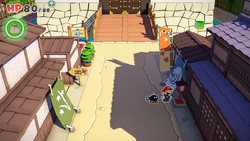 Mario standing near a lamp post containing a Small Bag of Confetti in Shogun Studios of The Origami King.