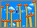 Mario in some type of mushroom land doing an unknown jumping pose.