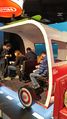 The Nintendo Switch being demonstrated in Handheld mode in a van setting