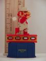 Pixelated figurine of Fire Mario walking on a steel girder