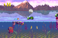 The Kongs find a bear coin above a Buzz in Tidal Trouble in the Game Boy Advance version of Donkey Kong Country 3