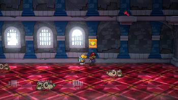 Mario next to the Shine Sprite in the stair switch room in Hooktail Castle in the remake of the Paper Mario: The Thousand-Year Door for the Nintendo Switch.