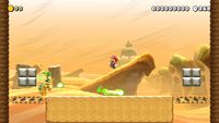 Iggy Koopa in a New Super Mario Bros. U-themed course in the Desert theme from Super Mario Maker 2
