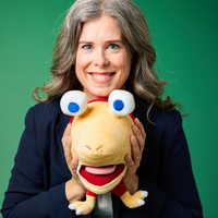 A photograph of future Nintendo of America president Devon Pritchard holding a Pikmin plush.