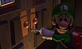 A frightened Luigi attempts to open the first locked door of the Gloomy Manor using a key. Luigi doesn't pose like this in the final version.