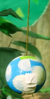 Two differently colored Party Balls in Yoshi's Crafted World
