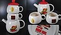 A set consisting of a teapot (Mario) and a pair of cups (Brick Block, and Coin); stylized from Super Mario Bros..