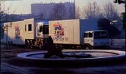 A truck being driven (top) and an unfolded truck (bottom)