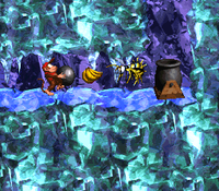 Diddy Kong carrying a kannonball to the kannon of Black Ice Battle in Donkey Kong Country 2: Diddy's Kong Quest