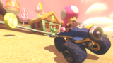 Toadette, driving around the track