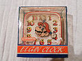 A square-rounded shaped clock; with the Mario head at the center, and both of the arms acting as the second and minute hand