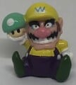 A figurine of Wario holding a Mega Mushroom from Mario Party 4