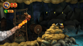 Donkey Kong approaches a Mole Miner who is mining rocks