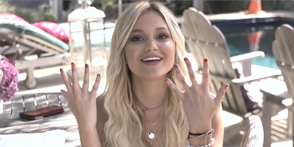 Still from a video presenting a Mario-inspired manicure session with American actress Olivia Holt