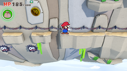 Mario standing near a 10-Coin in Spring of Rainbows of The Origami King.