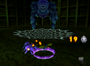 Tiny Kong, about to hit a Spider with a shockwave in the game Donkey Kong 64.