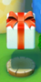 Screenshot of the Gift Box in Kingdom Builder in Super Mario Run. It is mid-jump.