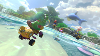 Yoshi driving the Wild Wiggler in Dolphin Shoals of Mario Kart 8