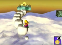 Wario crossing the chain of marshmallow blocks, as they vanish behind him.