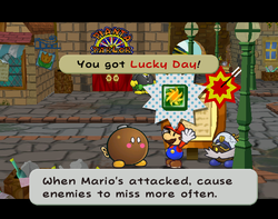 Mario getting the Lucky Day badge from Lucky in Rogueport of Paper Mario: The Thousand-Year Door.