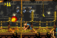 Kiddy Kong walking beneath three Karbines of Fire-Ball Frenzy in the Game Boy Advance version