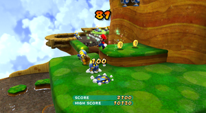 Playing through the level, collecting coins for points.