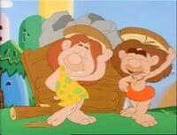 The Cave People using the wheels as hats in The Wheel Thing.