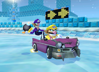 Wario and Waluigi driving through Sherbet Land in Mario Kart: Double Dash!!
