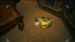 A piece of Cheese from Luigi's Mansion for the Nintendo 3DS.