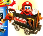 Diddy Kong pushing a Minecart with Mario riding in it as seen in the German GamePro magazine