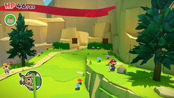 Mario standing near a rock containing a Small Bag of Confetti in Picnic Road of The Origami King.
