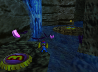 A set of purple Banana Coins and a purple Banana Bunch in Crystal Caves.