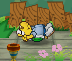 Koops flipped over following an attack of a Goomba in the game Paper Mario: The Thousand-Year Door.